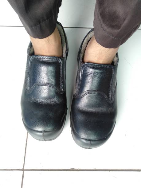 istock a lazy man wearing office shoes without socks 1295714349