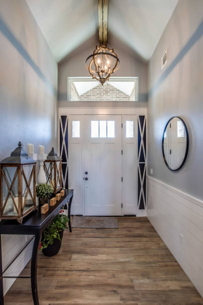 istock Narrow hallway leading to front door 1295718026