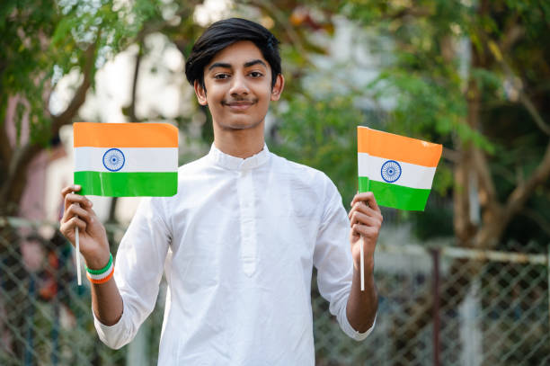 istock Young Indian boy with Tricolor Indian flag 1295718659