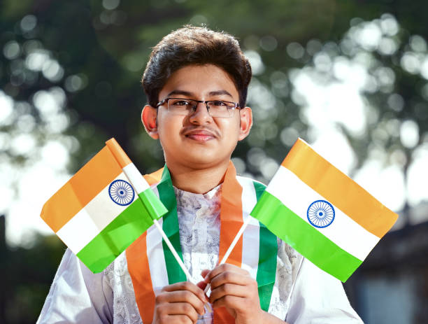 istock Young Indian boy with Tricolor Indian flag 1295718775