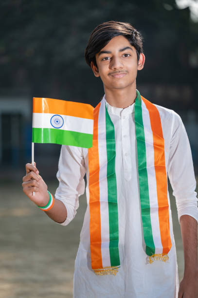 istock Young Indian boy with Tricolor Indian flag 1295718793