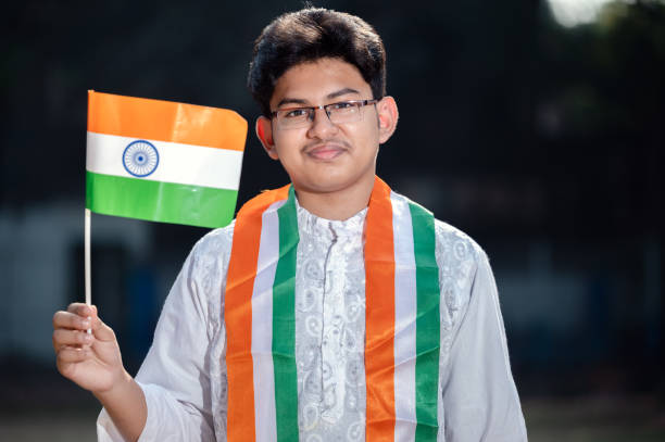 istock Young Indian boy with Tricolor Indian flag 1295720488