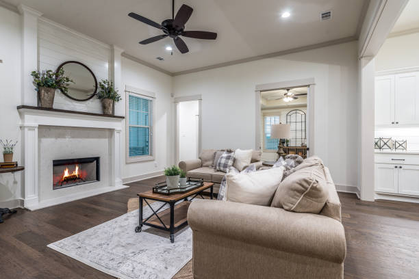 istock Beautiful white fireplace in living room 1295721478