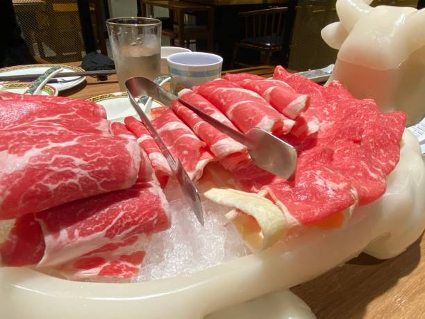 Sliced mutton for hotpot Sliced mutton ready for hotpot / shabu shabu mutton roll for chinese hot pot stock pictures, royalty-free photos & images