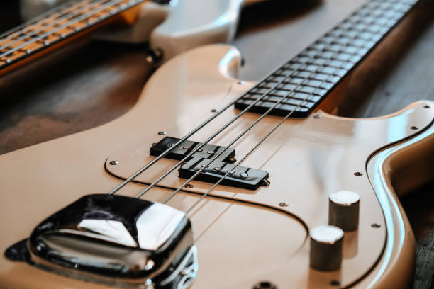 istock white Electric bass guitar closeup 1295724064
