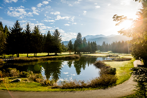 Scenic view of Whistler golf course with mountains in background.