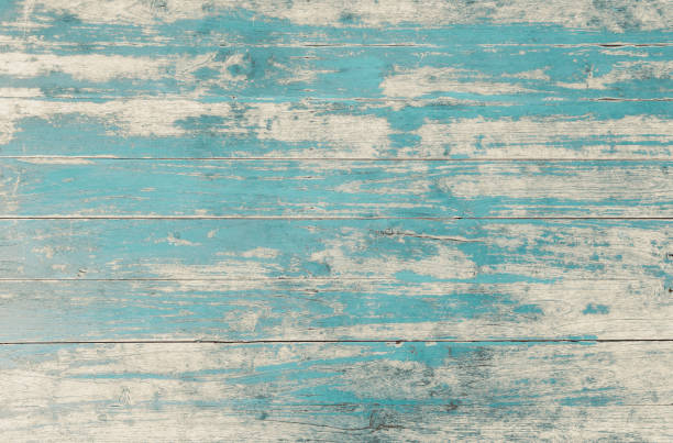 istock Weathered blue painted wooden wall. 1295729019