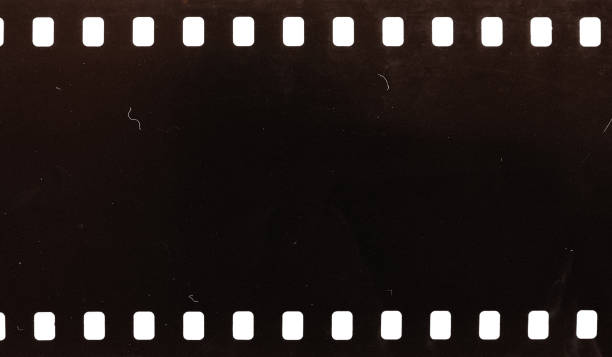 istock Dusty and grungy 35mm film texture material or surface 1295729188