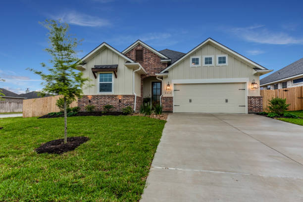 istock New home with brick and board and battin exterior 1295729194