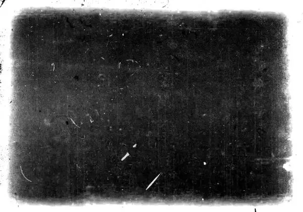 Abstract dirty or aging film frame. Dust particle and grain texture or dirt use for overlay film frame effect with space for vintage grunge design.