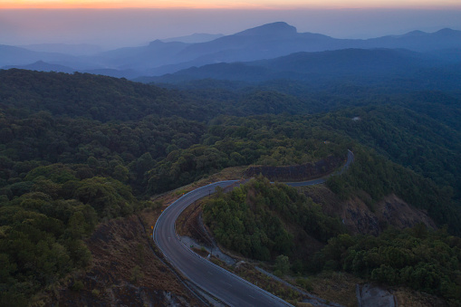 Aerial view (drone shot) of beautiful road with morning cloud at Doi Inthanon Chiangmai, Thailand.