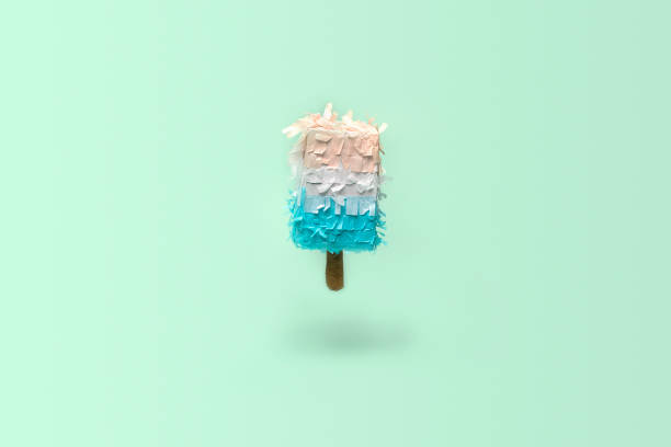 istock Paper creative popsicle decoration on light blue background. Ice cream in minimal style. Creative Xmas concept. 1295731584