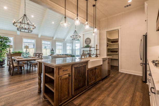 istock Natural wood flooring, cabinets and dining table 1295731735