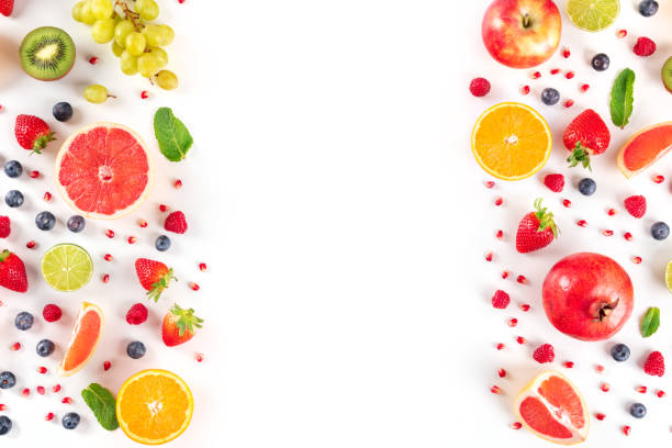 istock Fresh fruit design template, a flat lay on a white background with copy space, vibrant food pattern 1295734782
