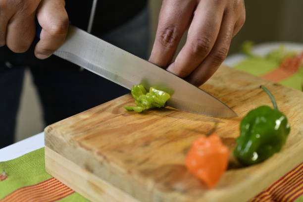 istock Cutting abanero pepper for sauce 1295739494