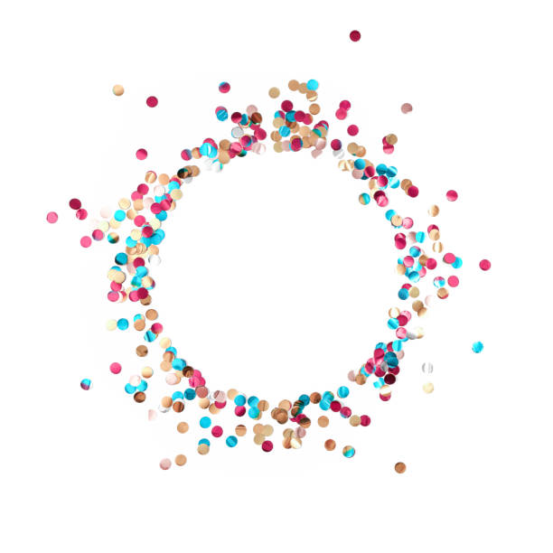 A round frame made of multicolored shiny metallized confetti is on a white background. Festive layout. Flat lay. Top view. Copy space. stock photo