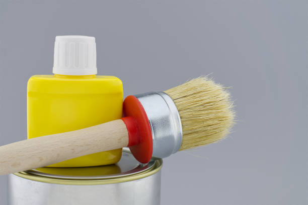 istock Clean bristle brush tin of paint over a grey 1295743279