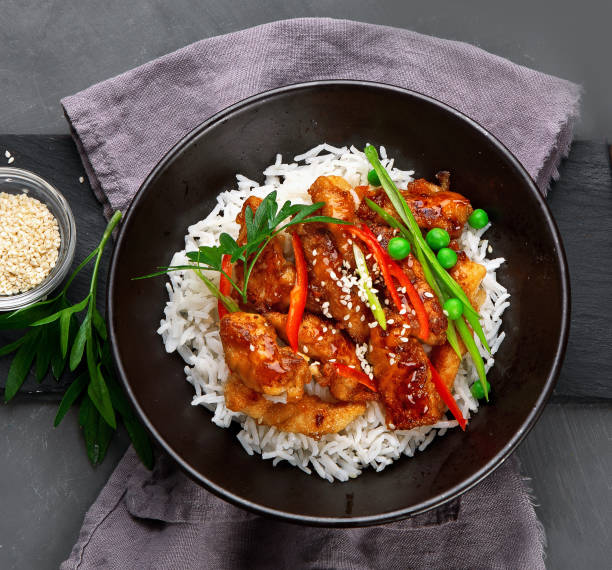 istock Chicken baked in sauce served with rice 1295744116