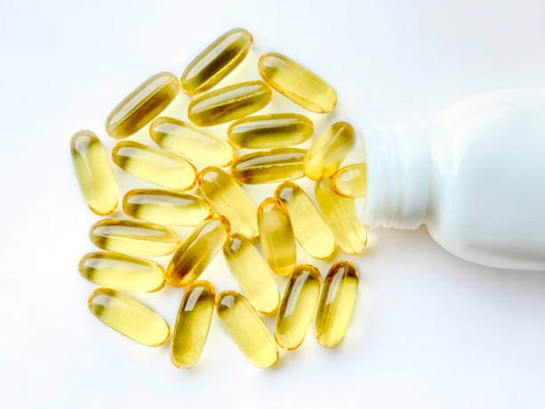 istock Omega-3 capsules with the bottle on white background. Polyunsaturated fatty acids. The concept of a healthy lifestyle. 1295744328