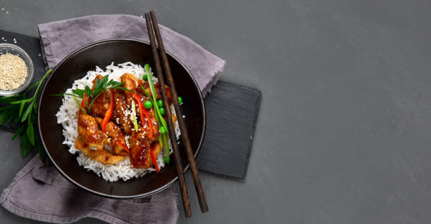istock Chicken baked in sauce served with rice 1295744349