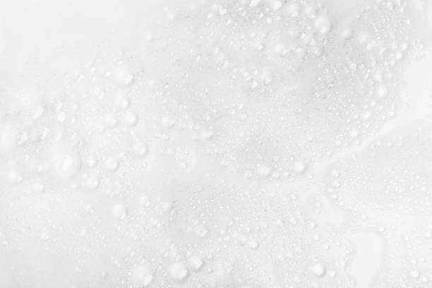 istock Foam bubble from soap or shampoo for washing isolated on white background from above 1295744880