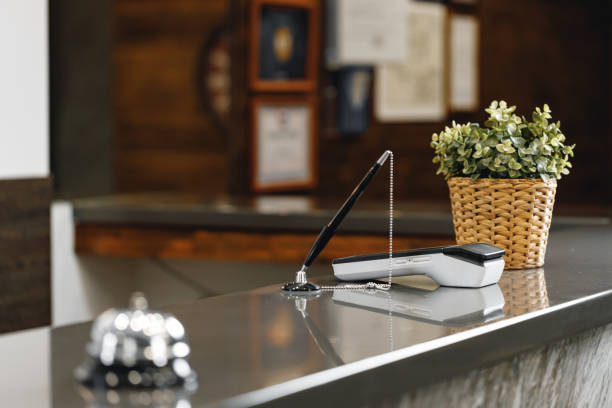istock Hotel service bell on front desk counter 1295745642