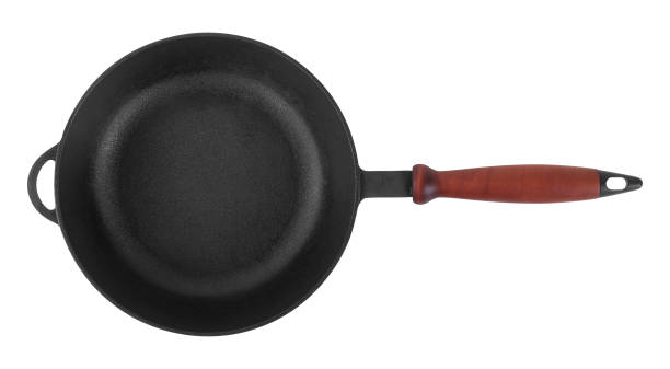 istock Kitchen accessories - Top view cast iron frying pan. Isolated 1295752644