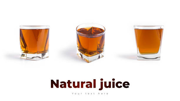 istock Apple juice in glass on a white background 1295753770
