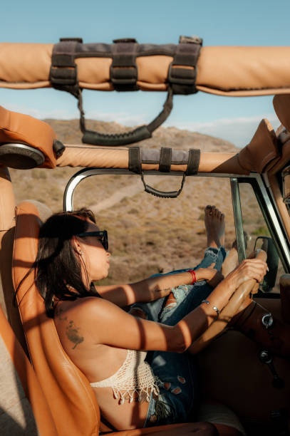 istock Woman driving a 4x4 off road 1295753827