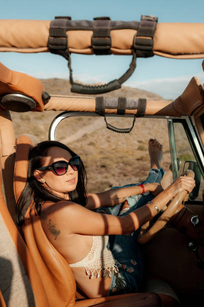 istock Woman driving a 4x4 off road 1295753829