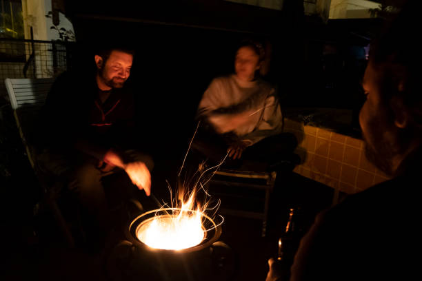 istock Night talk with camp fire and friends. 1295753930