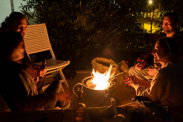 In backyard, night time, 4 best firends, sitting by fire and having good talk.