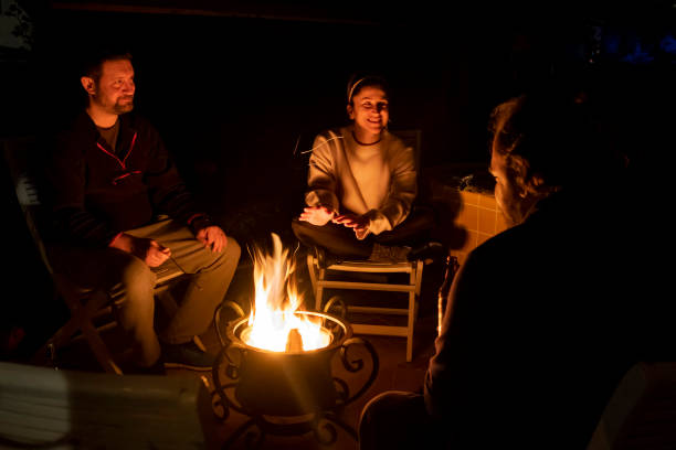 istock Night talk with camp fire and friends. 1295753940