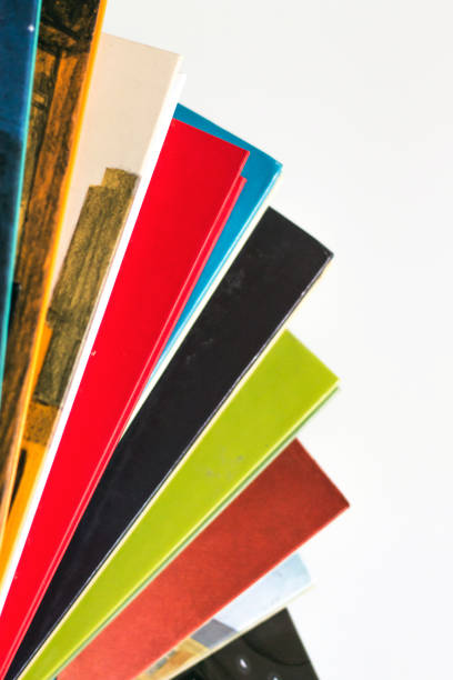 istock stack of books arranged in a fan shape, comics collection on white bakground 1295754666