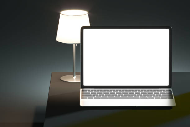 istock Black Laptop With Big Blank White Screen At desk near lamp. Copy Space. Empty Space. 3d rendering. 1295756163