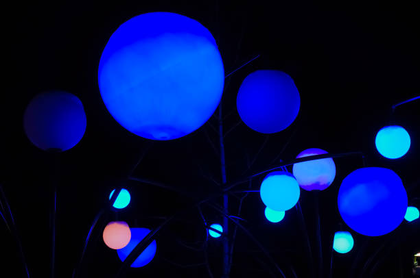 istock Colorful round lights on a dark background 1295760188