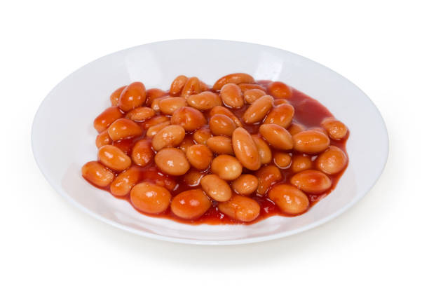 istock Stewed beans in tomato sauce on a white dish 1295760189