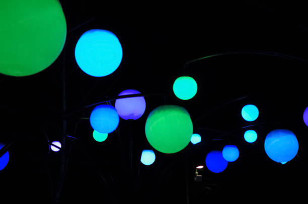 istock Colorful round lights on a dark background 1295760402