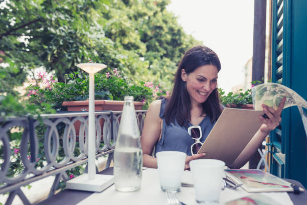 istock Young women enjoying in Italian restaurant 1295762019