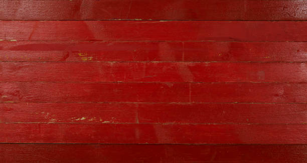 istock red, burgundy wood background, painted 1295762118
