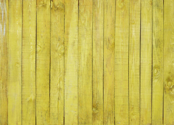 istock yellow wood painted background 1295764289