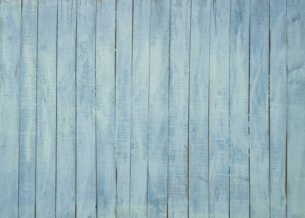 istock light blue painted wooden background 1295764613