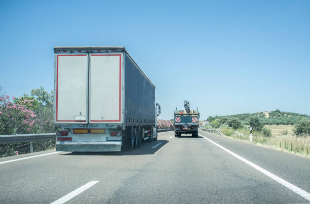 istock Truck overtaking slowly another truck 1295766034