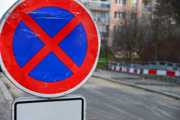 istock Road sign no stopping with white complementary sign. 1295766888