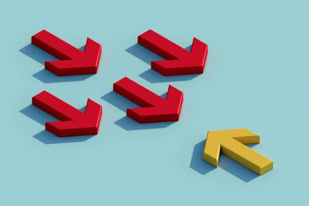 istock Yellow arrow facing the opposite direction red arrows. 1295767299
