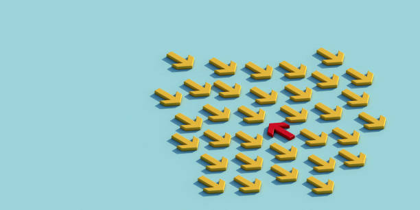 istock Red arrow facing the opposite direction yellow arrows. 1295767360