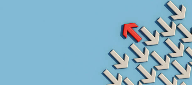 istock Red arrow facing the opposite direction white arrows. 1295767596
