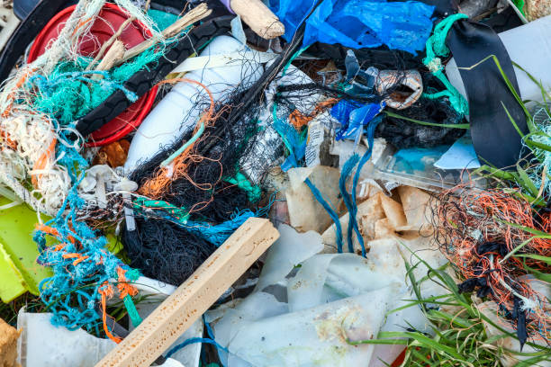 istock Plastic garbage waste with entangled fishing industry nets 1295769036