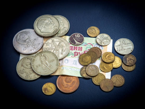 istock The old soviet coins and banknote are on the dark background. 1295771040