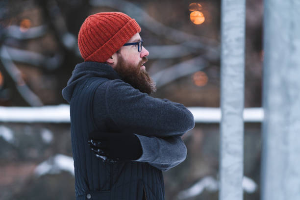 istock Warming up before exercising outdoors in the snow 1295773481